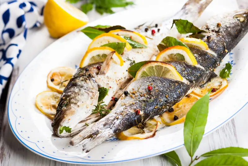 oven-baked-sea-bass-lemon-herbs-41481453.webp